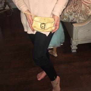 Light tan Coach wristlet